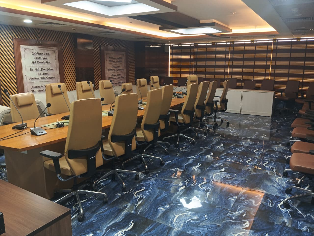 Delegate seating along the conference table, with additional rows behind.